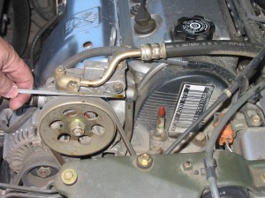 The engine oil level should be between the two marks on the dip stick. See the car's manual for specifics.