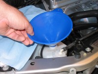 Add coolant as needed to the coolant reservoir, not the radiator.