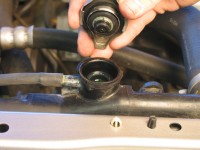 Once the cap is open, you can inspect the radiator or reservoir coolant level.