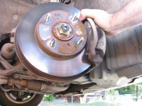 Disc brakes can be seen by removing the tire rim lugs and removing the tire.