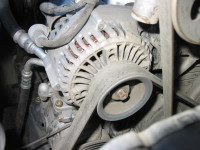 An engine belt turns the alternator which produces electricity for storage in the battery.