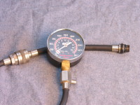 An automotive compression tester can help you discover whether an engine cylinder is developing compression. If not, the piston rings or valves may be a problem.