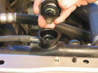 Carefully remove the radiator cap when the engine is cool.