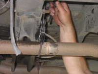Make sure the exhaust pipe has no holes and that the hangars are in good condition.