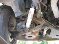 Shock absorbers are installed behind wheels to dampen the effect of bumpy roads.