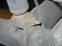 Shock absorbers and struts typically are attached to the car's frame with a bolt at each end.