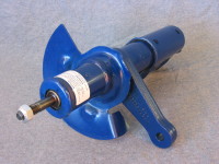 A strut is similar to a shock absorber but uses torque to minimize bumps.