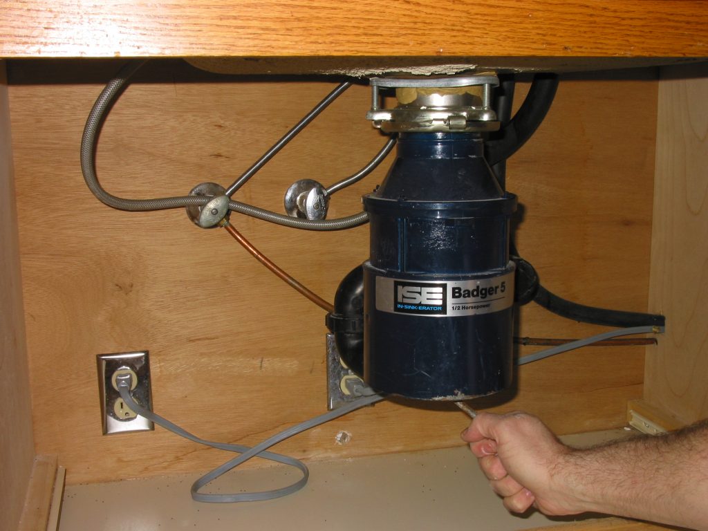 how to replace garbage disposal motor